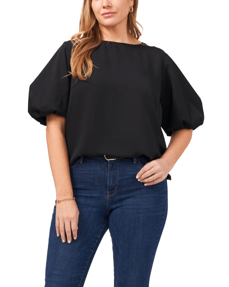 Front of a model wearing a size 1X Luxe Puff Sleeve Blouse in Rich Black by Vince Camuto. | dia_product_style_image_id:261271